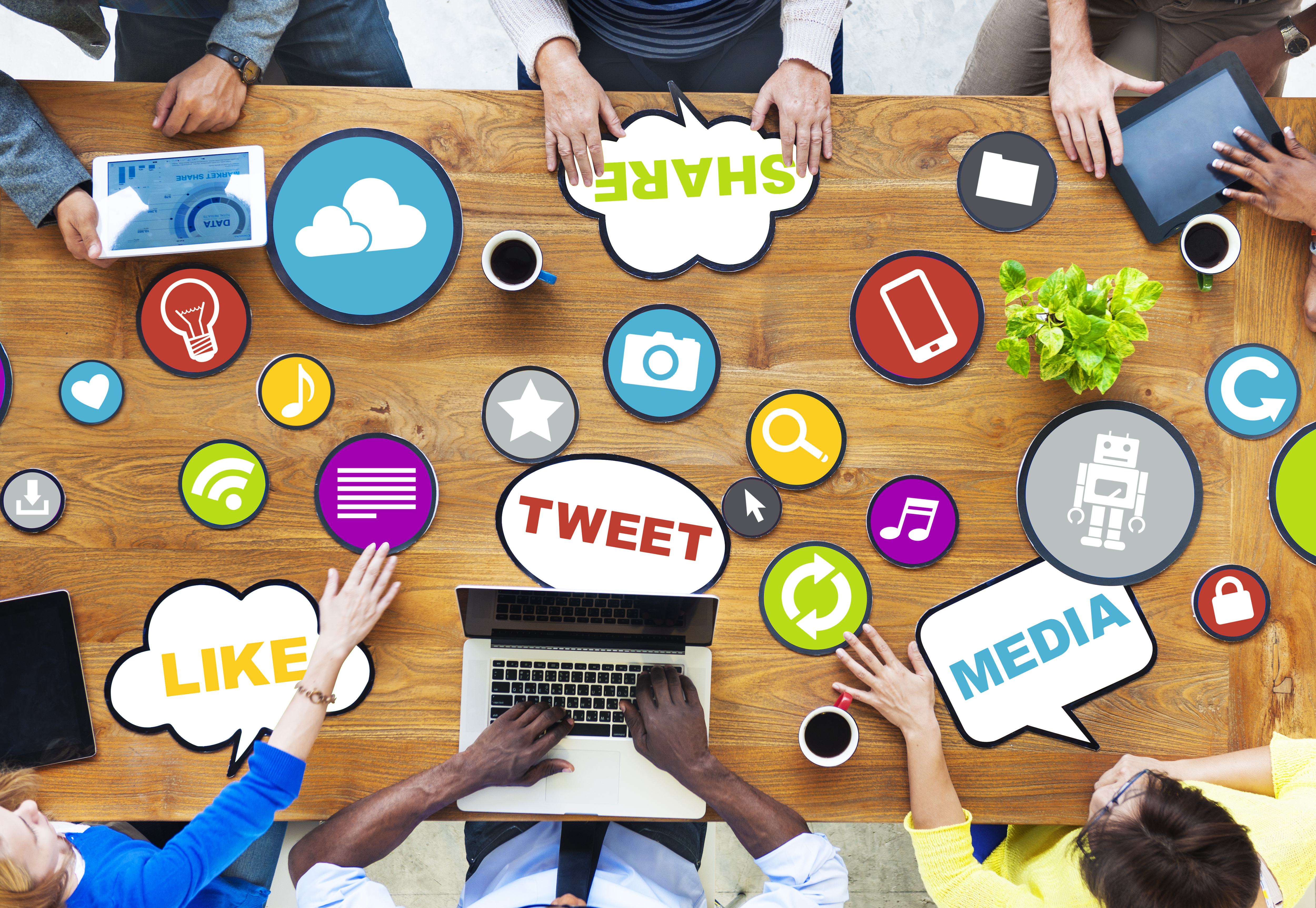 Employees sitting at table sharing ideas on marketing